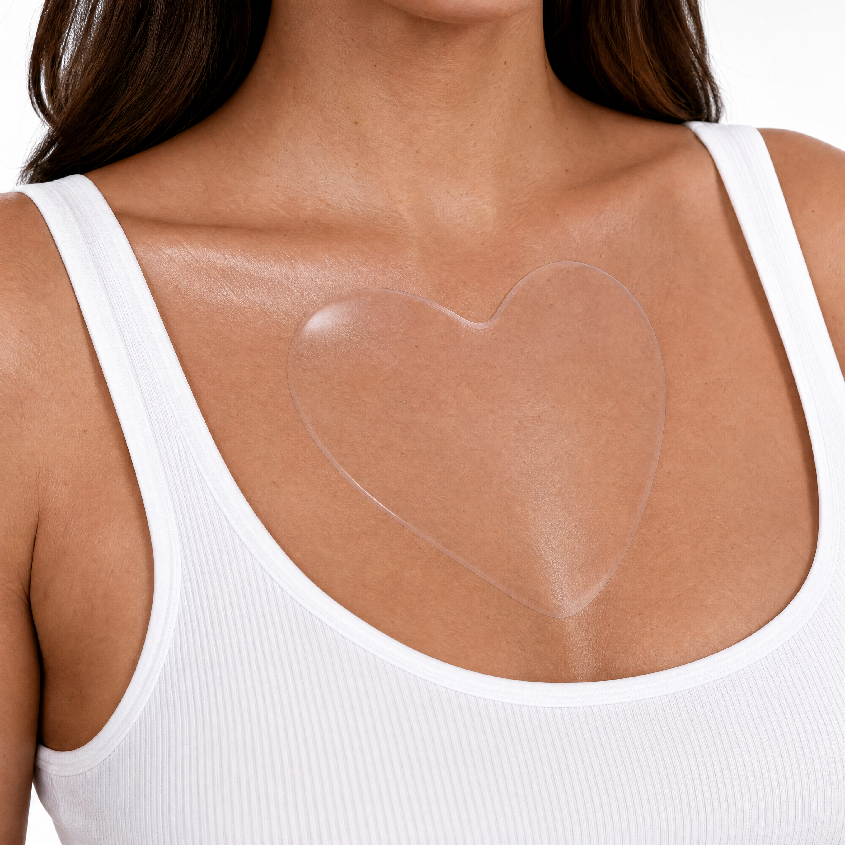 Generated_with_Kive.ai_-_Keep_the_same_close-up_composition__same_model_pose__same_white_tank_top__and_the_same_heart-shaped_silicone_chest_pad_placement_and_appearance._Make_the_skin.png